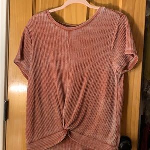 a cute top that has a knot at the bottom